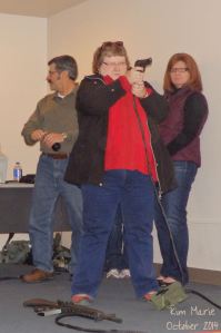 Kim shooting a gun using air during scenarios at Alpena Combat Readiness Training Center